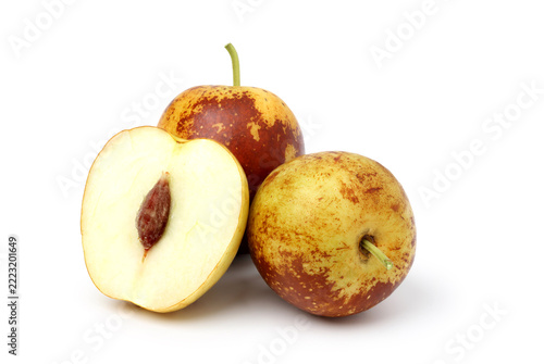 Fresh jujubes piled together. isolated on white background.