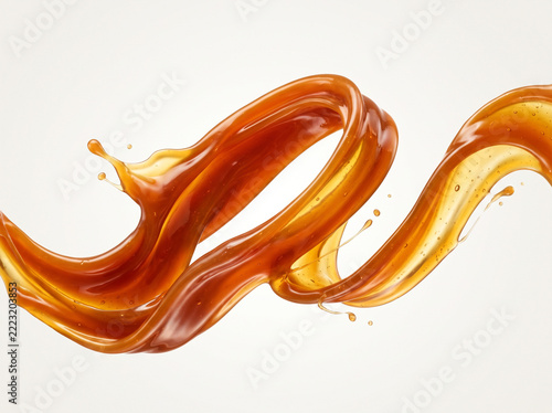 Dynamic caramel sauce or maple syrup liquid swirl isolated on white background with copy space