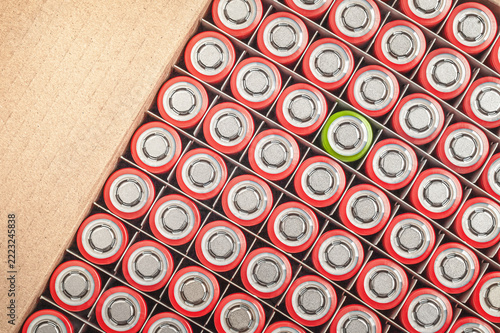 Green battery unique stand out from red batteries pattern