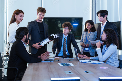 Obraz na plátně Diverse Technology Team Discussing a Robotic Hand During a Group Meeting Around