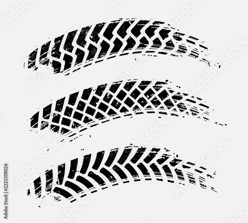 Curved tire tracks with grunge texture. Vector skid marks.