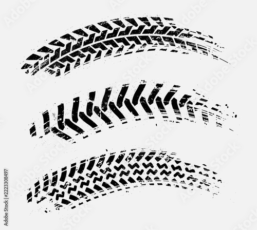 Curved tire tracks with grunge texture. Vector skid marks.