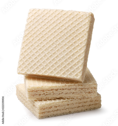 Square wafers are stacked on top of each other on a white. Isolated