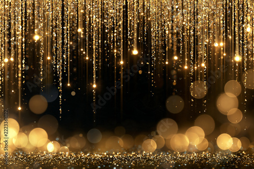 Golden droplets cascade against a deep black void. Soft bokeh lights shimmer in the foreground. Glowing particles create a luxurious, festive atmosphere. Ideal for celebrations, luxury branding