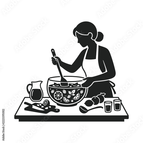 Woman preparing fresh fruit salad in a large bowl.