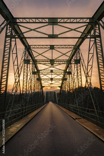 Beautiful vertical shot of a bridge at sunset