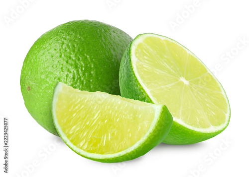Fresh limes isolated on white. Whole and sliced