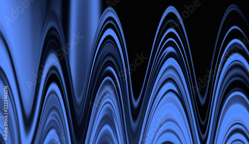 Abstract blue waves ripple across a dark background creating smooth motion