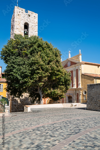 Historic church and bell tower overlooking a peaceful square in Antibes