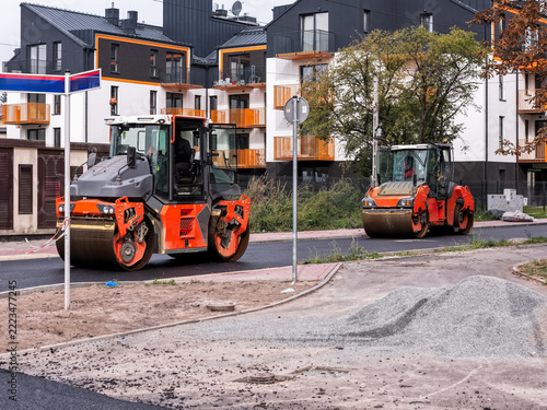 Road Construction with Asphalt Rollers in a Residential Area