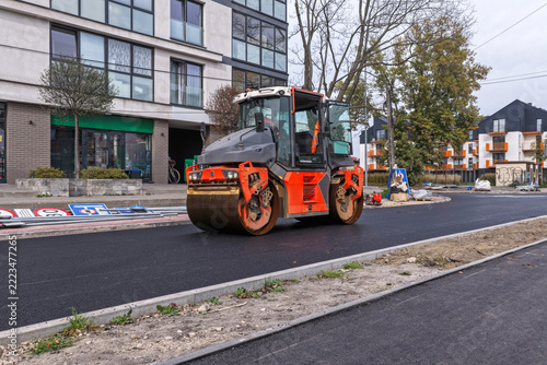 Road Construction with Asphalt Rollers in a Residential Area