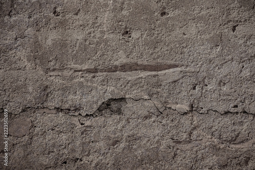 Rough damaged concrete wall background.