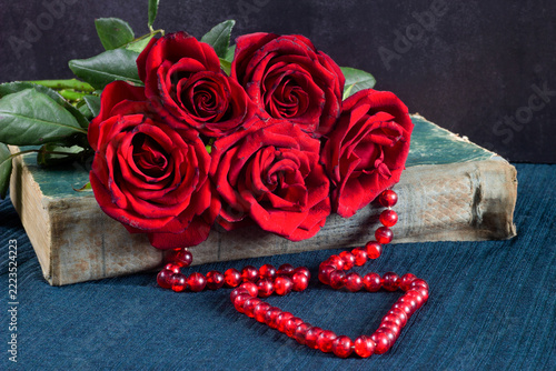 red rose on a wooden background