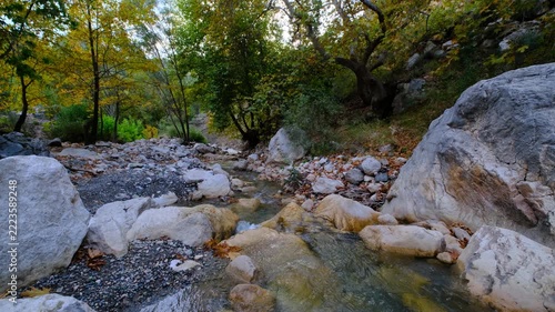 Scenic Woodland Creek with Multiple Cascades in Autumn. Tiered Waterfalls Flowing Through an Autumn Forest Stream. Small Cascading Waterfalls in a Colorful Fall Woodland.