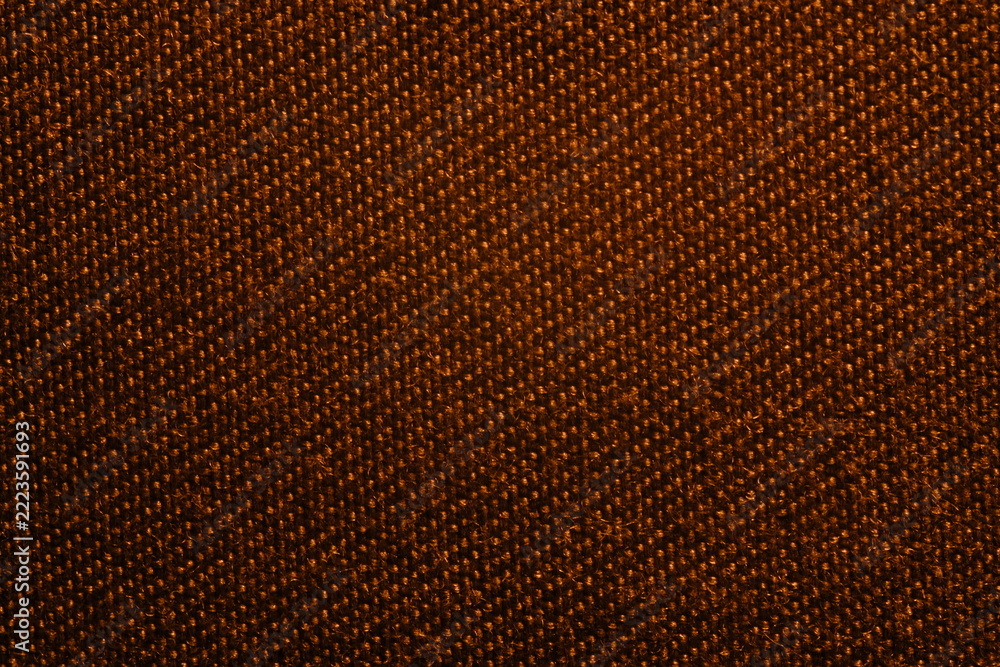 Fototapeta premium A close-up shot of a textured brown fabric with a distinct woven diagonal pattern.