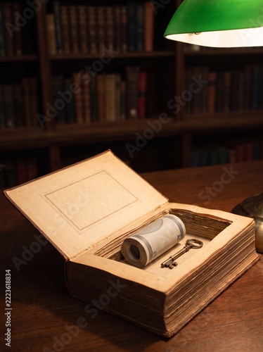 Roll Of Money And Old Key Hidden In Hollowed Book