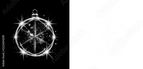 Glowing Christmas ball with snowflake and bright star flares around the glass ring on black and transparent background