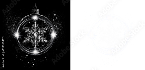Transparent glass Christmas ornament with crystal snowflake and shining light points on black and transparent background