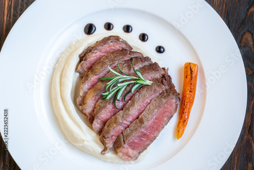 Restaurant style Wagyu steak with celery root puree carrots rosemary and balsamic glaze