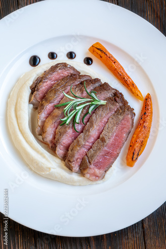 Restaurant style Wagyu steak with celery root puree carrots rosemary and balsamic glaze