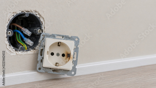 Removed Wall Outlet With Subtle Overheating Damage and Copy Space