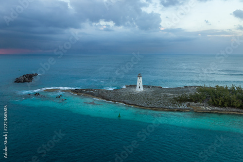 Exposure done at sunset of the Nassau Harbour Lighthouse near Colonial Beach, built in 1847, with the awesome turquoise blue waters surrounding the beautiful island of the Bahamas