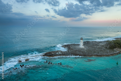 Exposure done at sunset of the Nassau Harbour Lighthouse near Colonial Beach, built in 1847, with the awesome turquoise blue waters surrounding the beautiful island of the Bahamas