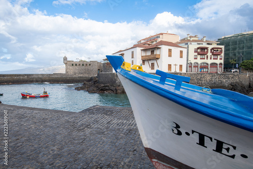 Traditional fishing boat in the historic harbor of Puerto de la Cruz, Tenerife, Canary Islands, the identification plate of the boat is not complete