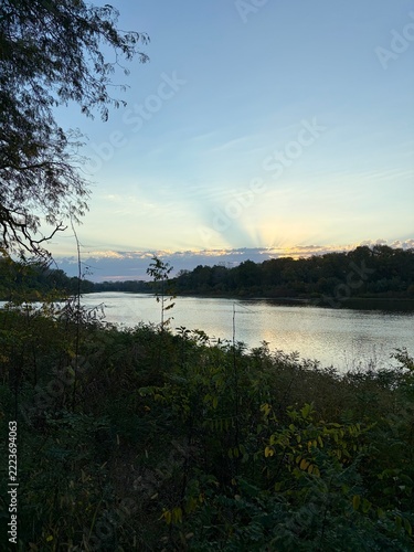 scenic view of a sunrise on the river