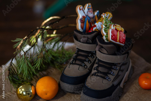 St Nicholas Holiday Surprise with Colorful Candy and Winter Boots. Colorful candy and gifts celebrate winter holiday traditions.