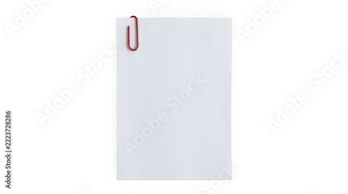 Red paperclip attached to a blank white sheet of paper isolated on a