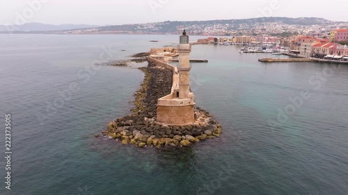  View of Chania with the amazing lighthouse, mosque, venetian shipyards, Crete, Greece.Waves crashing on lighthouse, Beautiful Greece and best scenic places - panorama