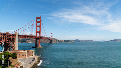Golden Gate Bridge spanning the entrance of San Francisco Bay, California, USA, with historic Fort Point and the Marin Headlands on a clear summer day