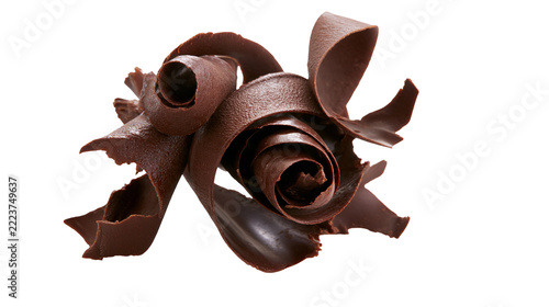 Isolated chocolate curls arranged artfully for dessert decoration, delicious sweet treat