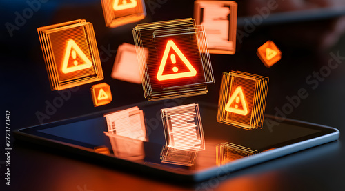 Digital file security notice with illuminated orange warning icons superimposed on holographic documents projected onto a tablet screen for enterprise data risk management and cybersecurity defense