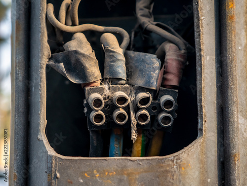 Dusty and Neglected Electrical Wiring Connections Covered in Cobwebs
