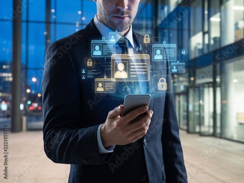 Businessman using smartphone with digital interface and security icons.
