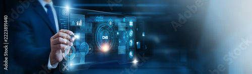 CMS Developer interacting with CMS and futuristic holographic digital network interface control panel. Content management, website development, digital publishing, web design.