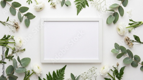 Minimalist Framed Picture Surrounded by Fresh Greenery and Flowers