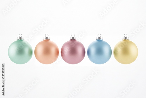 Five Pastel Christmas Ornaments in a Row on Clean White Background