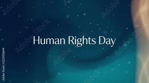 Human Rights Day text on a dark blue abstract background with glowing light effects and small white particles, celebrating global human rights.