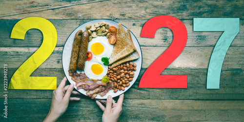 English Breakfast Plate Forming 2027 Year Concept on Wooden Table