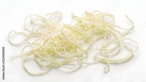 A vibrant overhead view of freshly chopped white onions carefully arranged in a lovely textured heap on a clean white background ideal for food photography