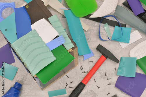 Upcycling plastics. Various sized, colorful pieces of plastic ready for reuse. Reusing multicolored plastic bottles and using them as a colorful mosaic. Top view table and shallow depth of field.