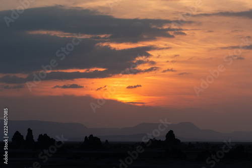 Dramatic sunset sky with dark clouds over limestone chimneys, Lake Abbe, Djibouti