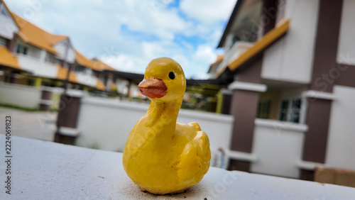 Yellow Rubber Duck Toy with Skyline Background at Residential Area