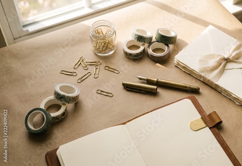 Elegant stationery flat lay on kraft paper
