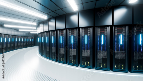 Server racks aligned in a modern data center room with illuminated