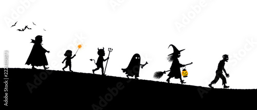 Groups of children walk along a hill for Halloween night. They wear different costumes and carry items like a broom and a pumpkin. Bats fly above them
