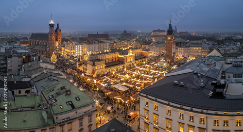 Krakow, oland, evening aerial view of illuminated Main Square with Christmas Fairs crowded with people
